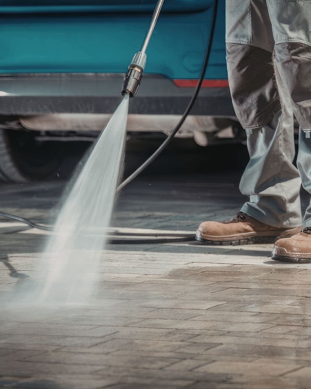 Pressure washing a concrete surface